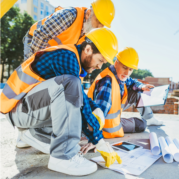 handsome-construction-workers-sitting-on-concrete-2024-11-19-14-08-00-utc